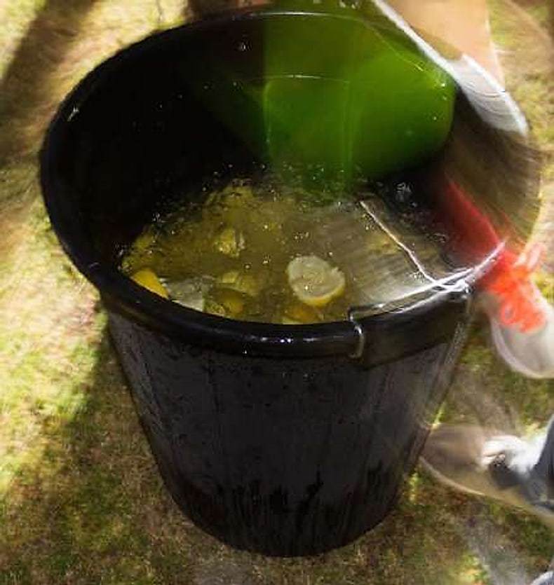 Pouring Yakka, the traditional debating drink
