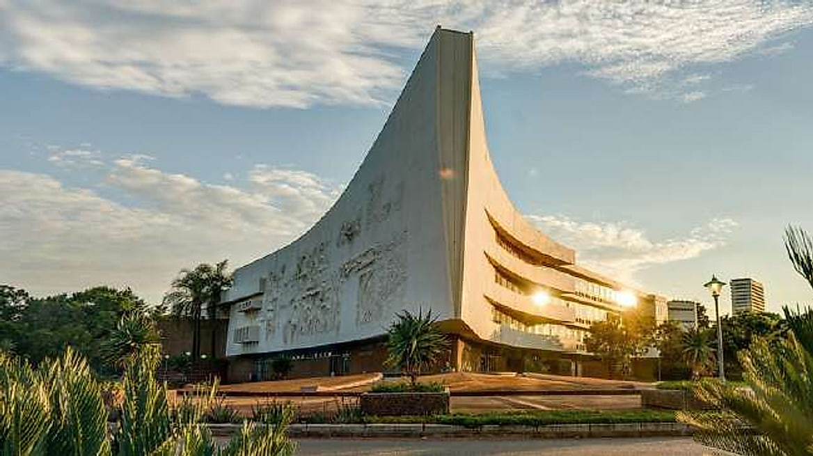 A University of Pretoria campus building at dusk